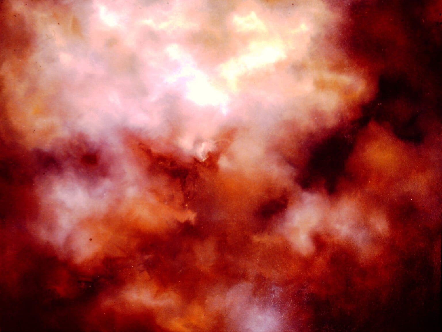 Abstract fiery clouds blending red, orange, and white hues.