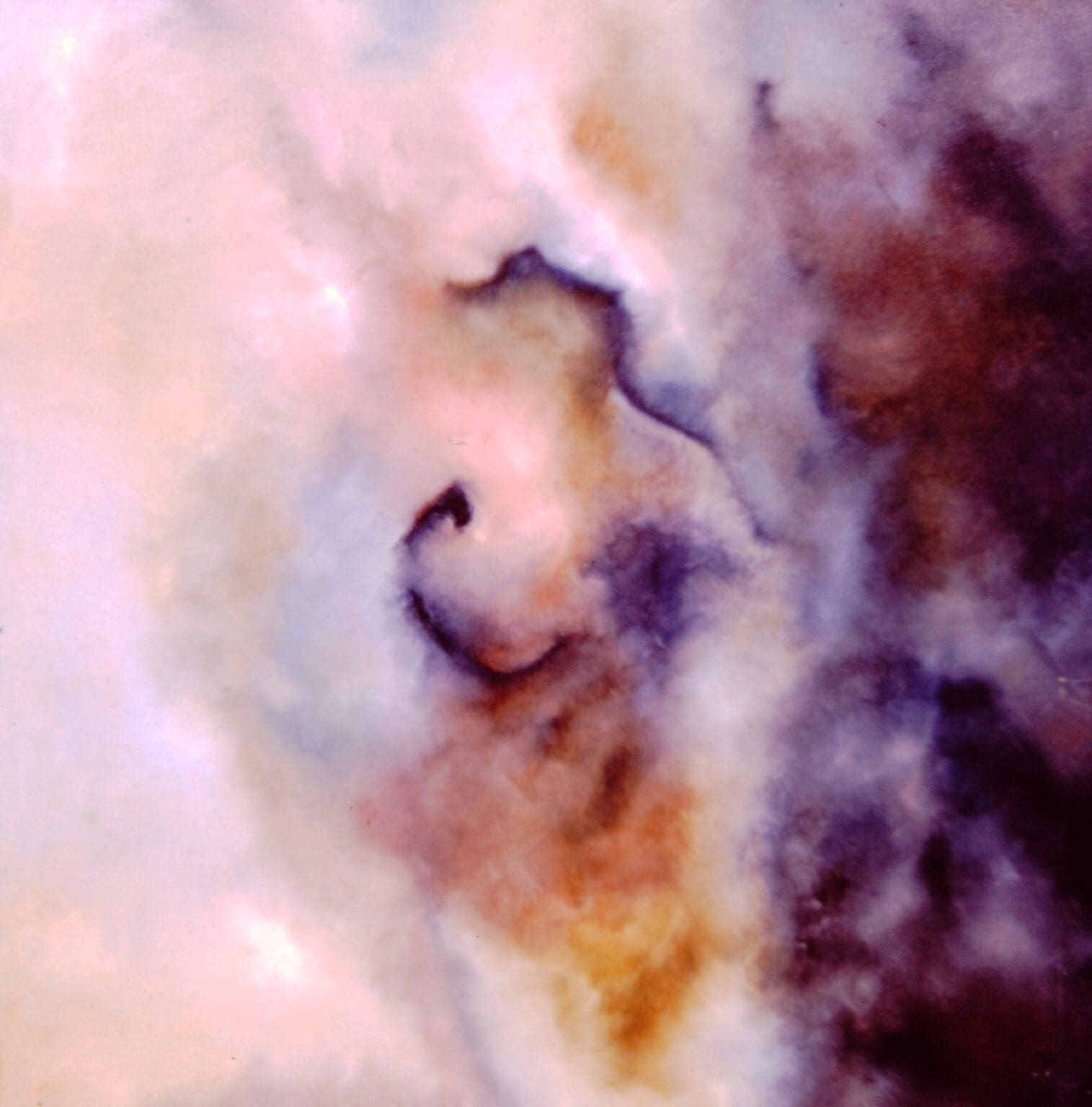 Abstract cloud formation with swirling colors.