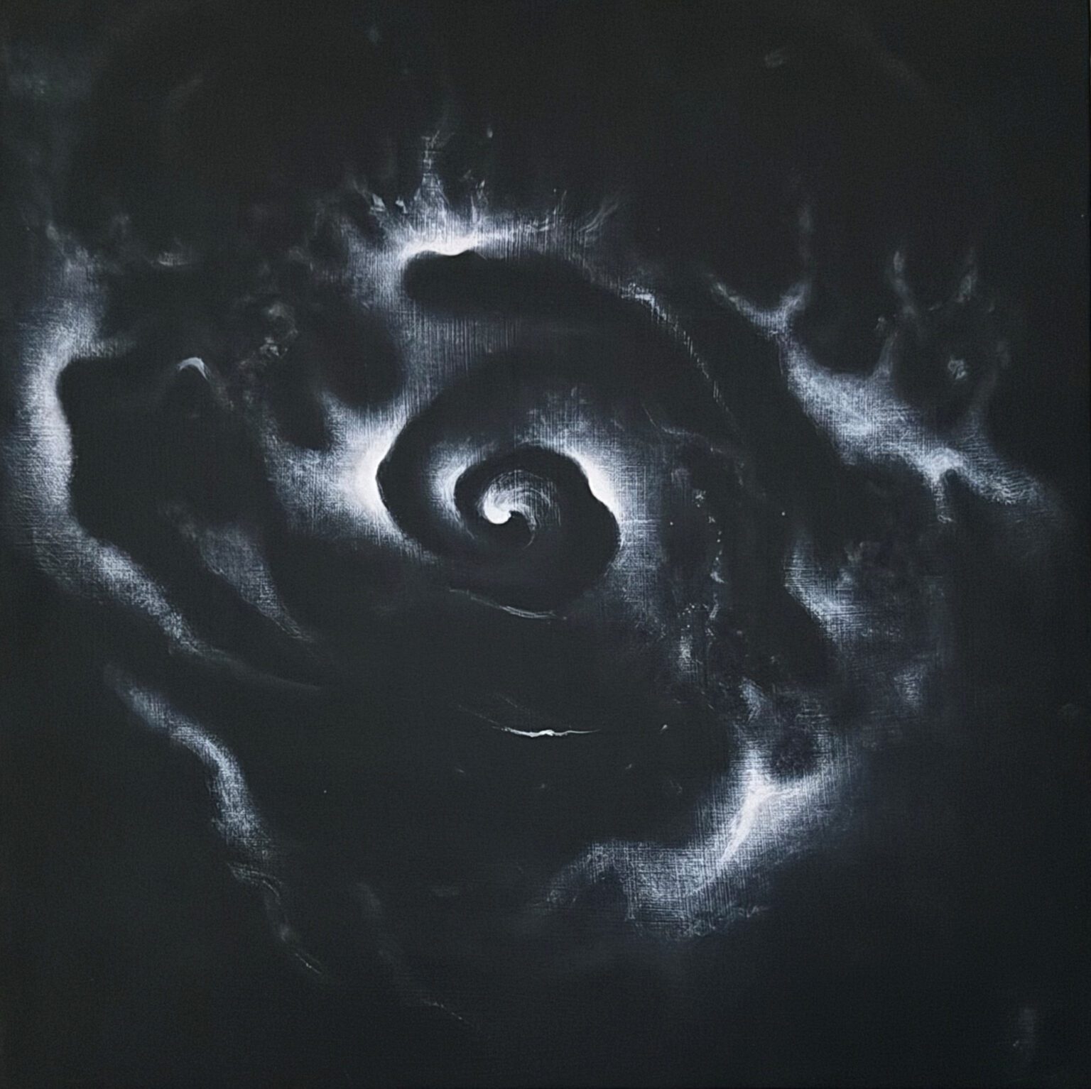 A dark, swirling vortex with glowing edges resembling a cosmic spiral.