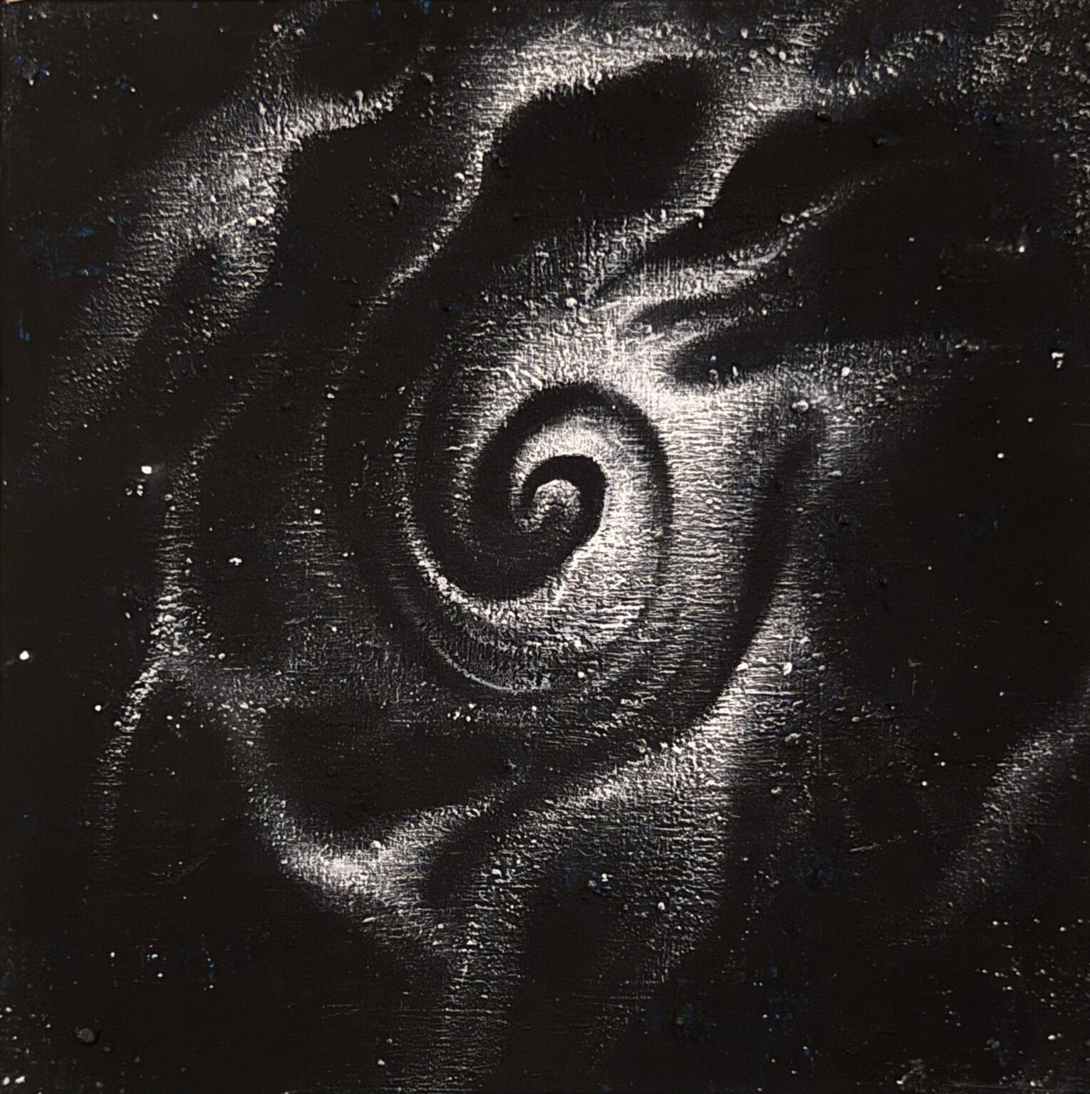 A swirling galaxy with bright stars and cosmic dust in space.