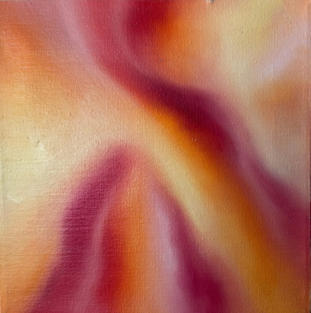 Abstract artwork with flowing warm hues of red, orange, and yellow.
