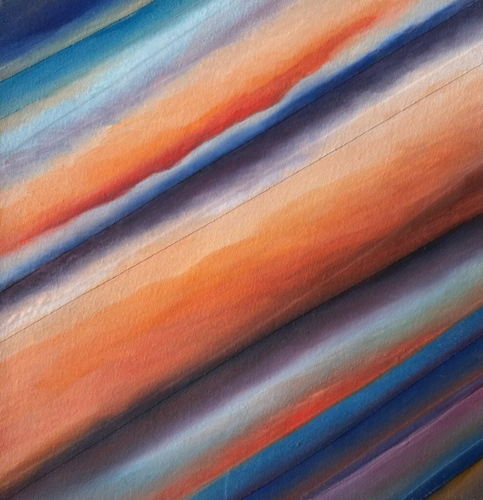 Abstract diagonal stripes in warm and cool colors blending smoothly.